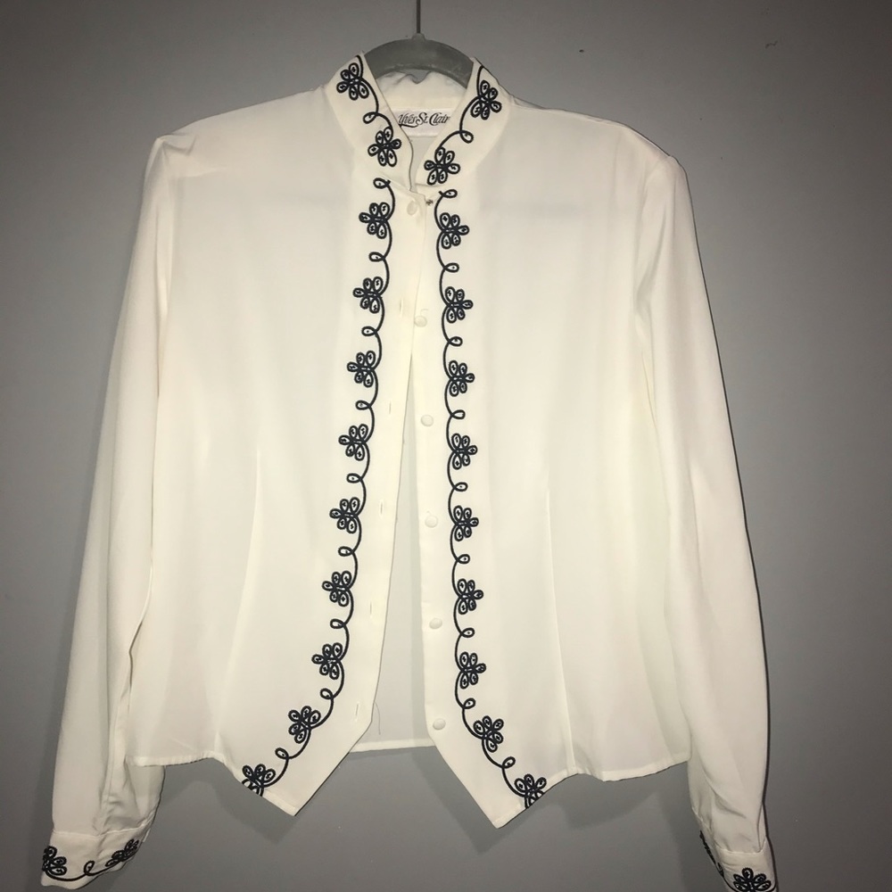 white blouse with black accents